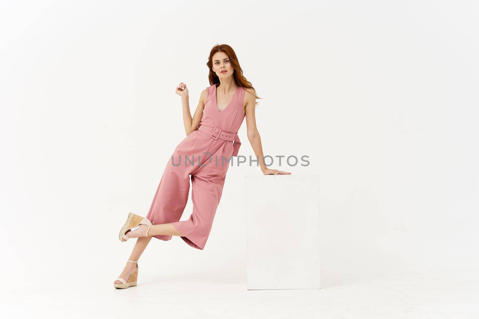 pretty woman in pink suit sunglasses fashion summer style posing. High quality photo