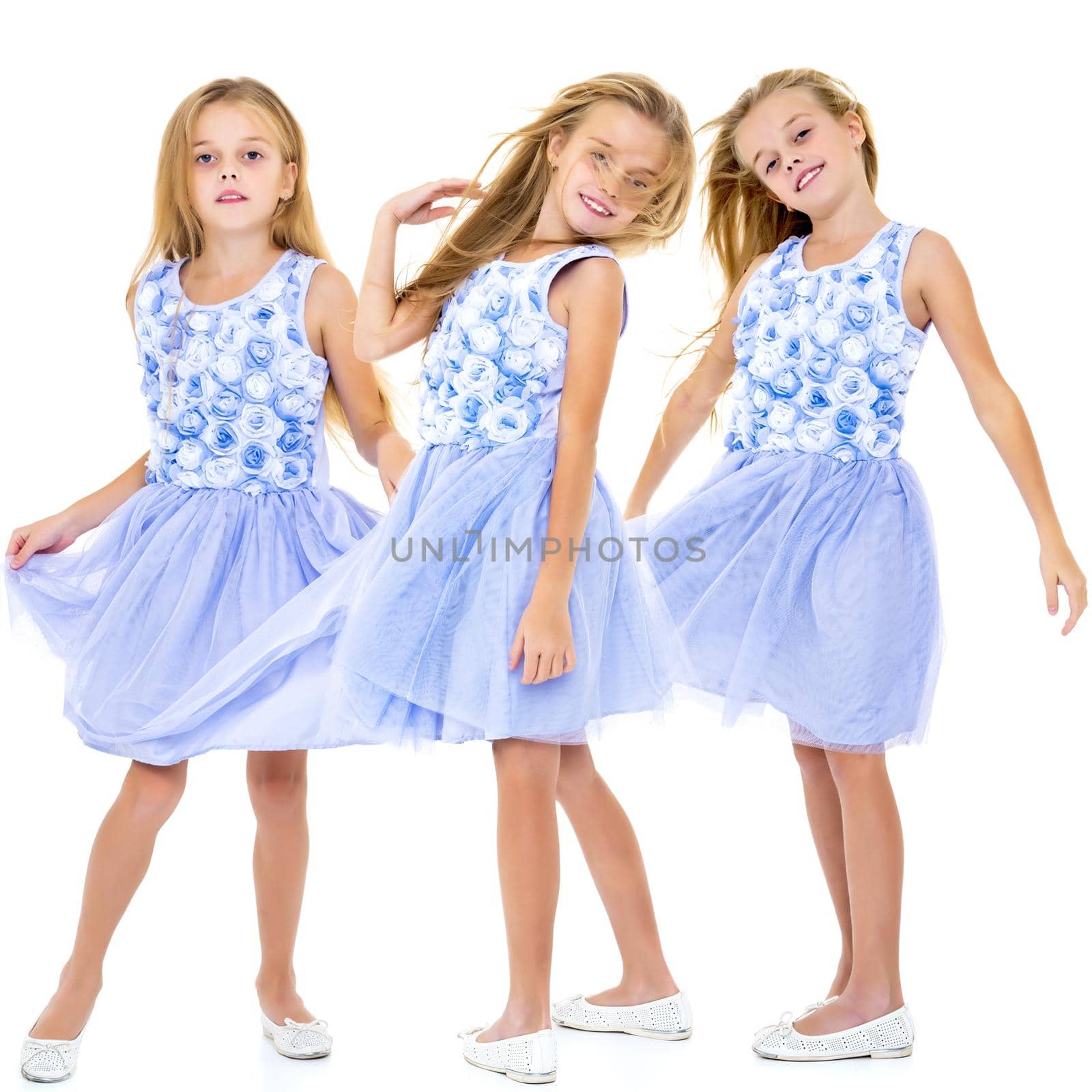 A collage of photos of one girl.Portrait of a positive and stylish little girl in a summer dress, rejoices in the wind that blows and moves her dress and hair. The concept of beauty and fashion.