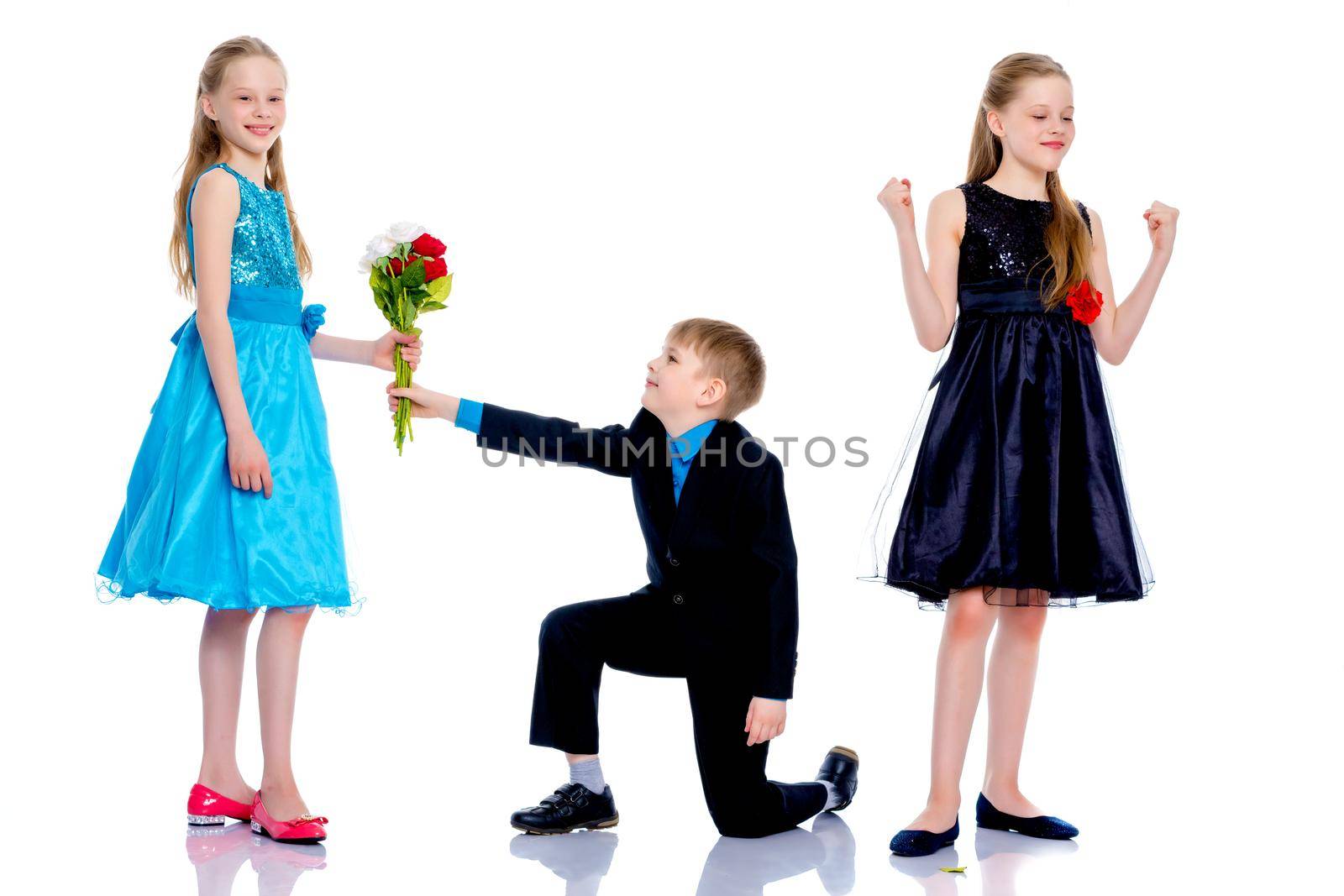 A little boy gives the girl flowers. by kolesnikov_studio