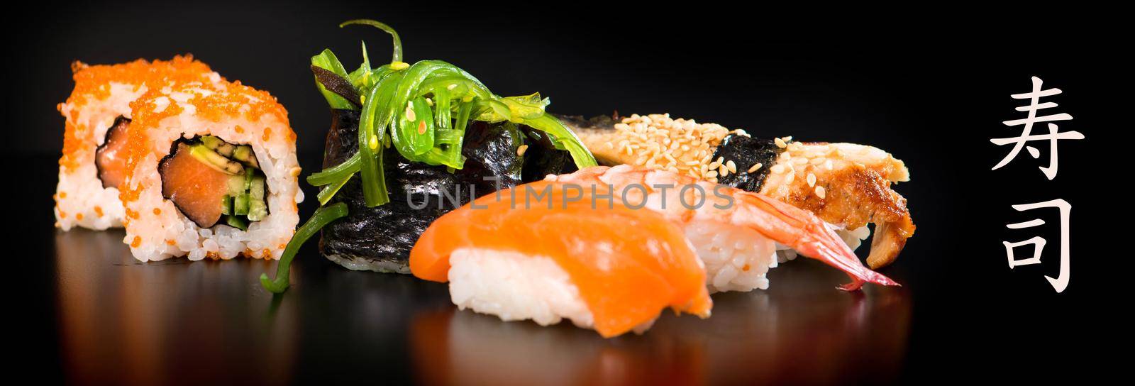 Sushi and Rolls closeup on black background
