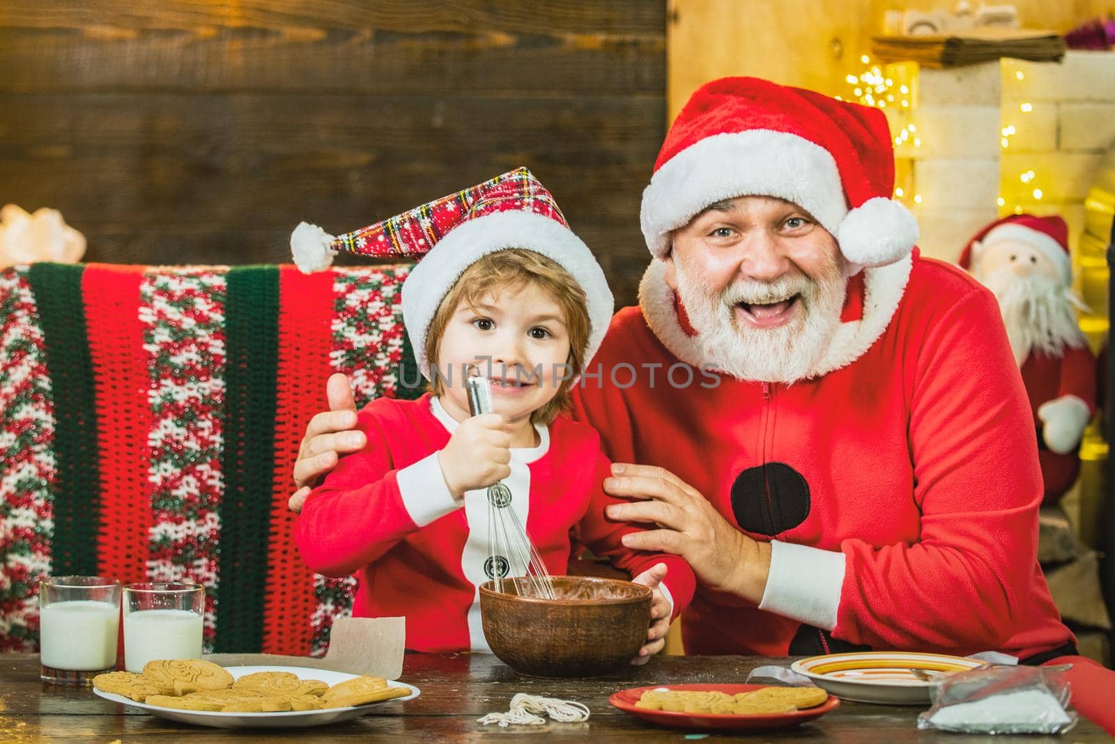 Happy grandfather and child grandson cooking Christmas cookie. Christmas kitchen. by Tverdokhlib