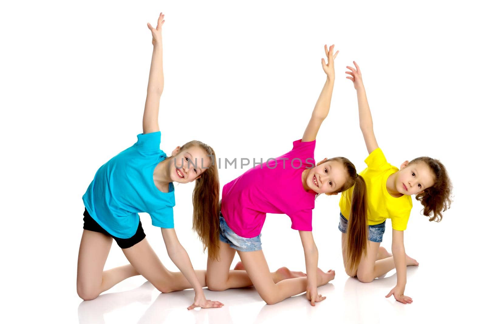 A group of girls gymnasts perform exercises. by kolesnikov_studio