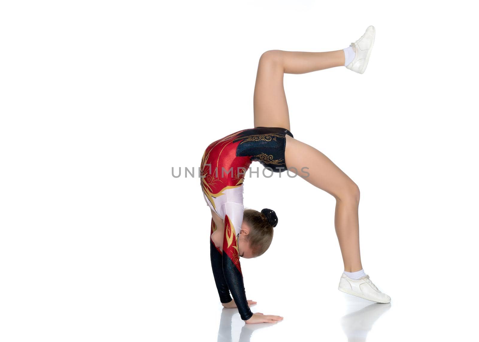 Girl gymnast performs a bridge with a raised leg. The concept of a healthy lifestyle, sport. Isolated on white background.