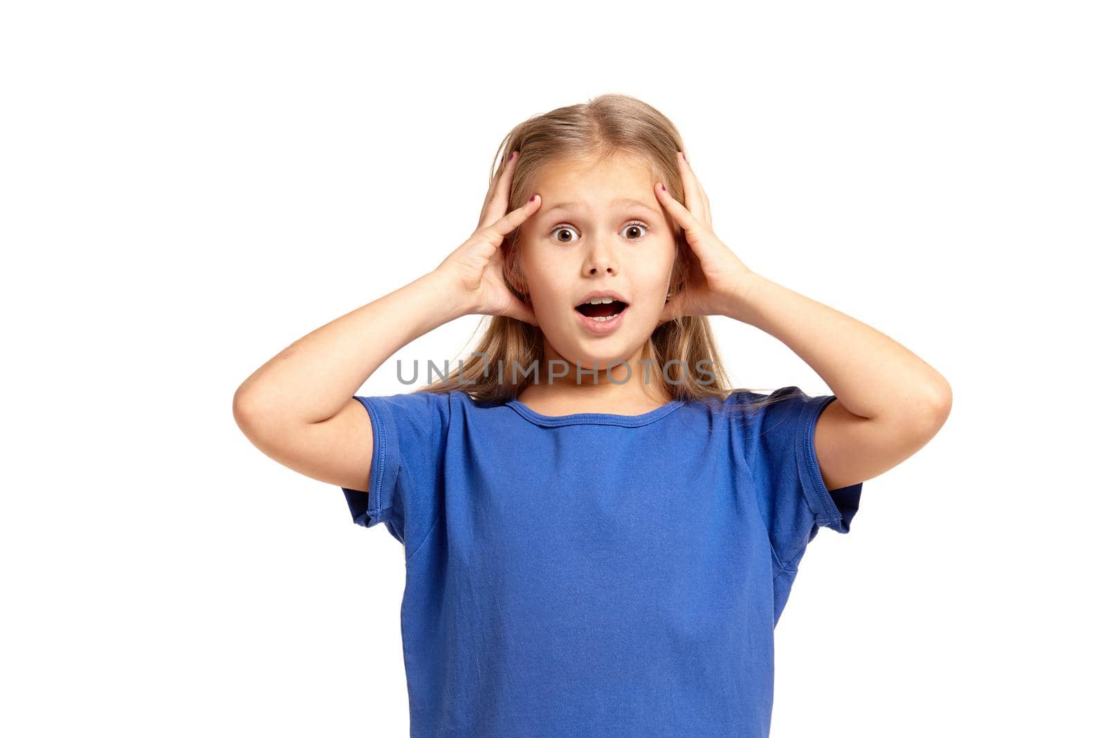 Portrait of adorable little girl isolated on a white background. in blue t-short with long white hair, worried, holding her head