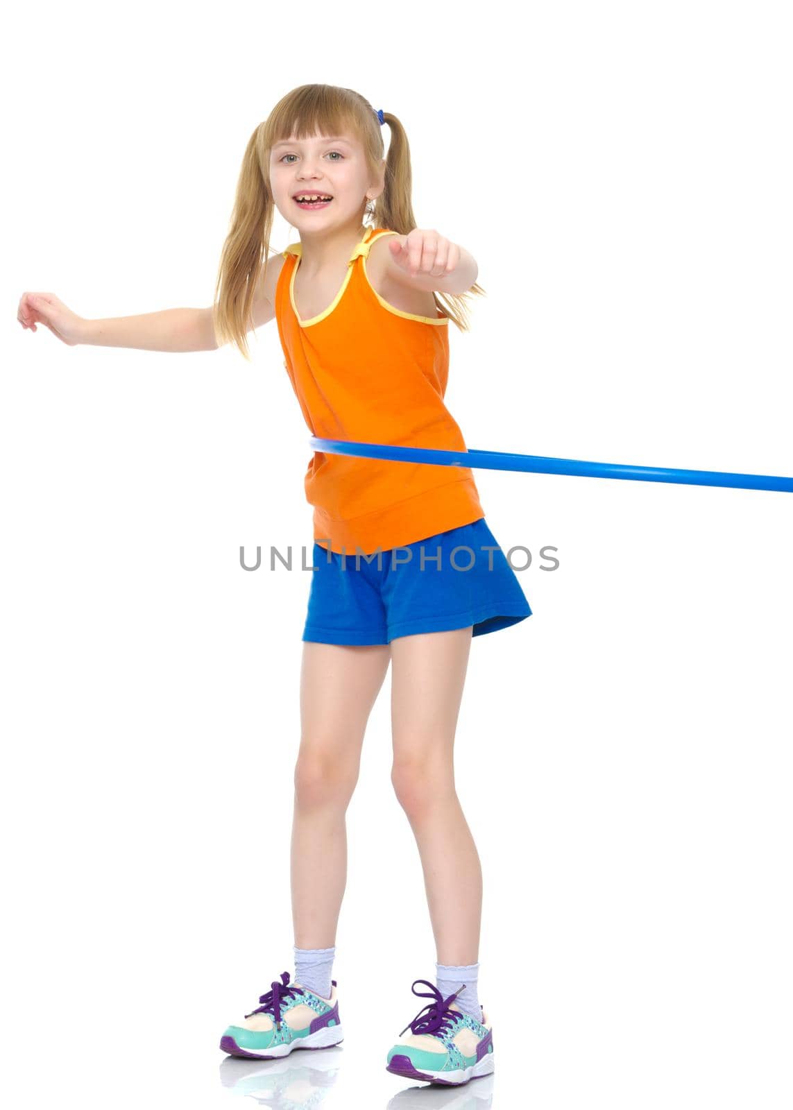 A girl gymnast performs an exercise with a hoop. The concept of gymnastics and fitness. Isolated on white background.