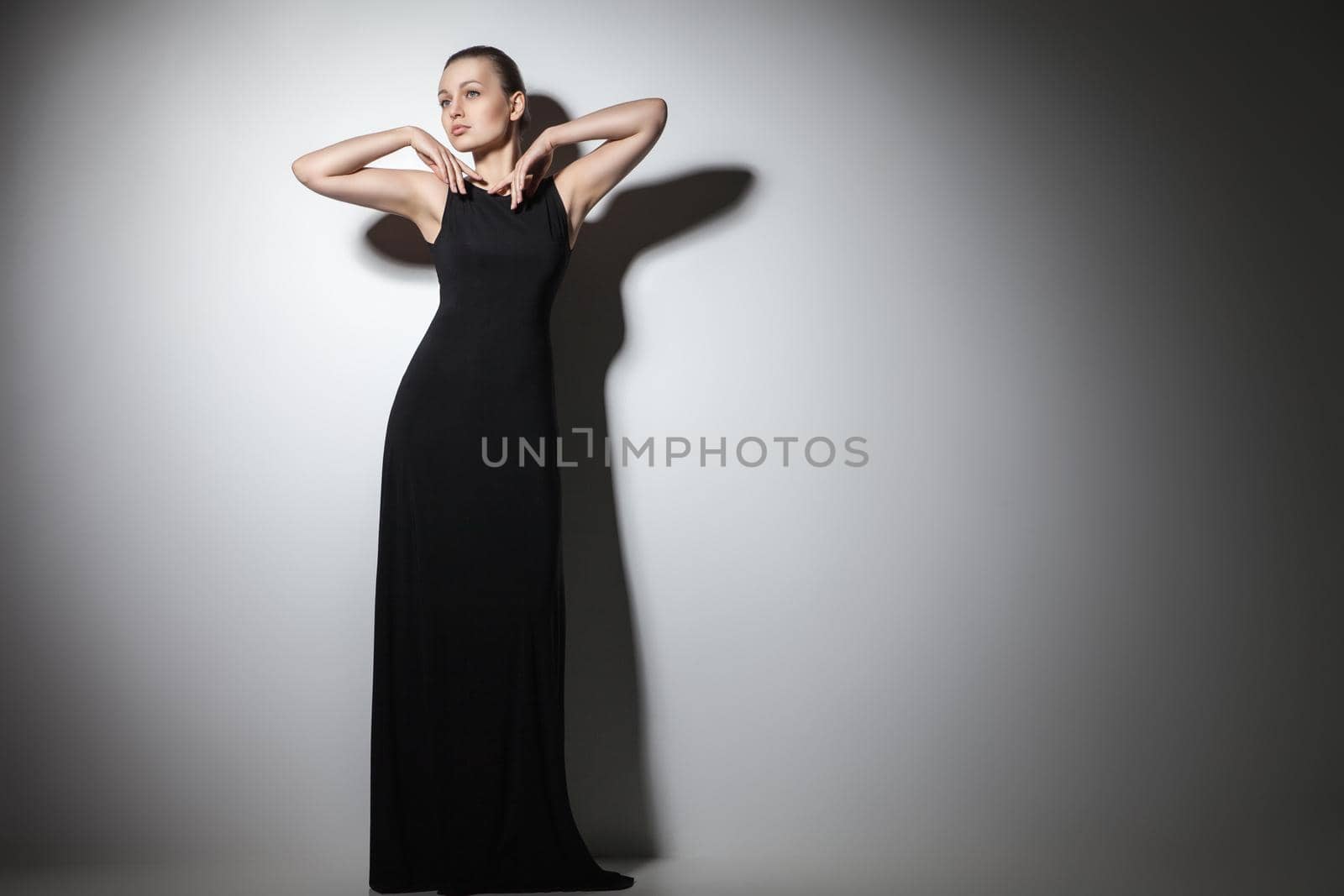 beautiful woman model posing in elegant black dress by Julenochek