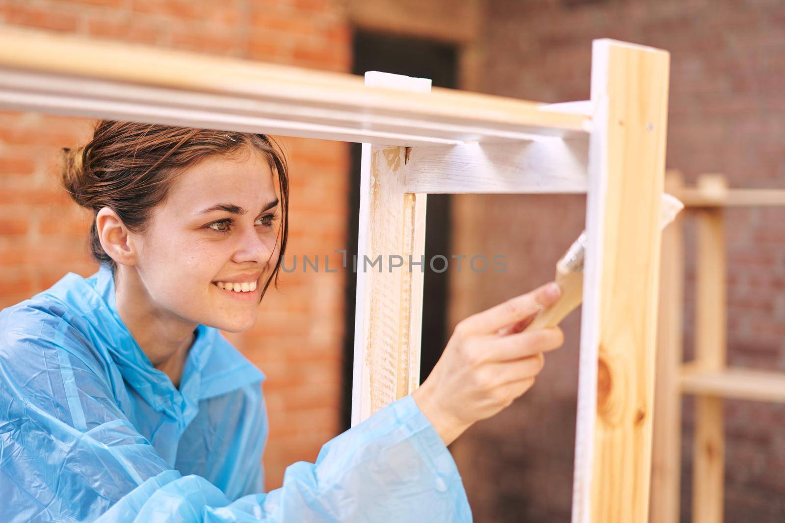 woman paints wood painter repair protective suit by Vichizh