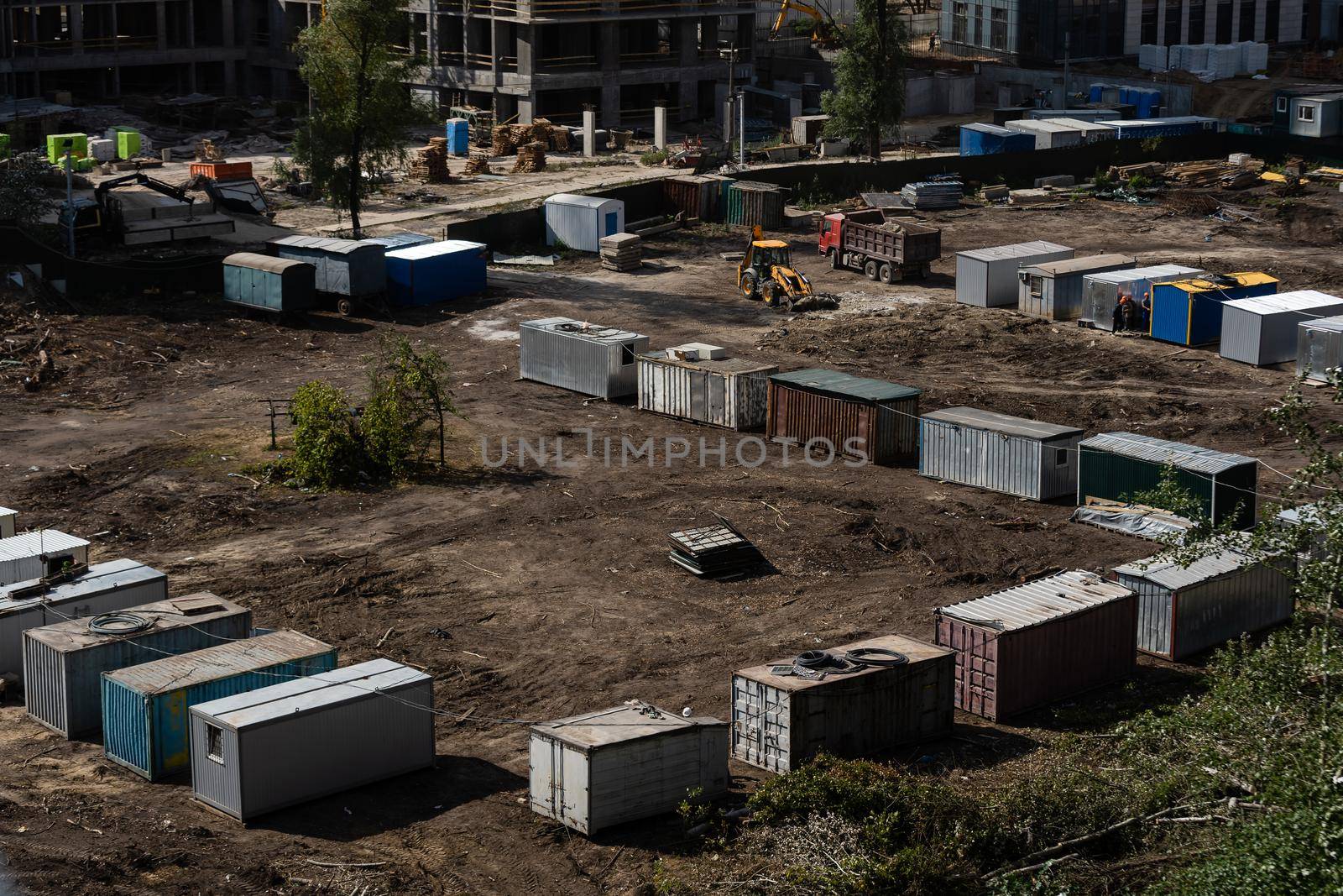Construction trailers for workers at the new construction site. Mobile containers and cabins base for the site manager and employees.