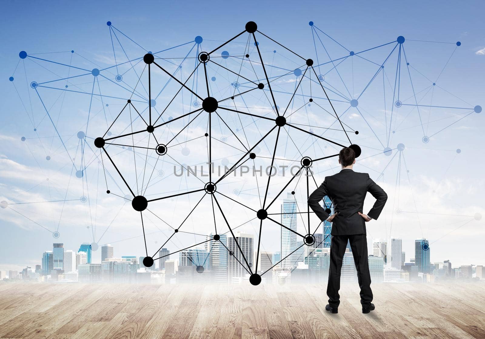 Businessman standing with back and looking at network drawn concept