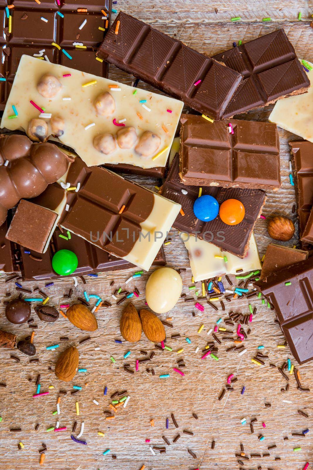 chocolate and candies on a wooden background