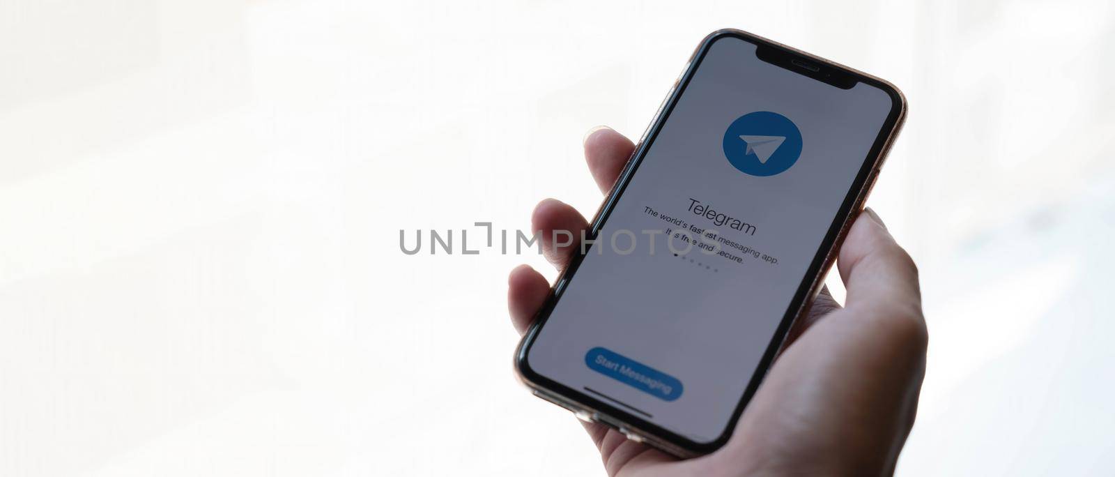 CHIANG MAI, THAILAND MAY 6 2020 : Telegram application icon on Apple iPhone Xs screen close-up. Telegram app icon. Telegram is an online social media network. Social media app by wichayada