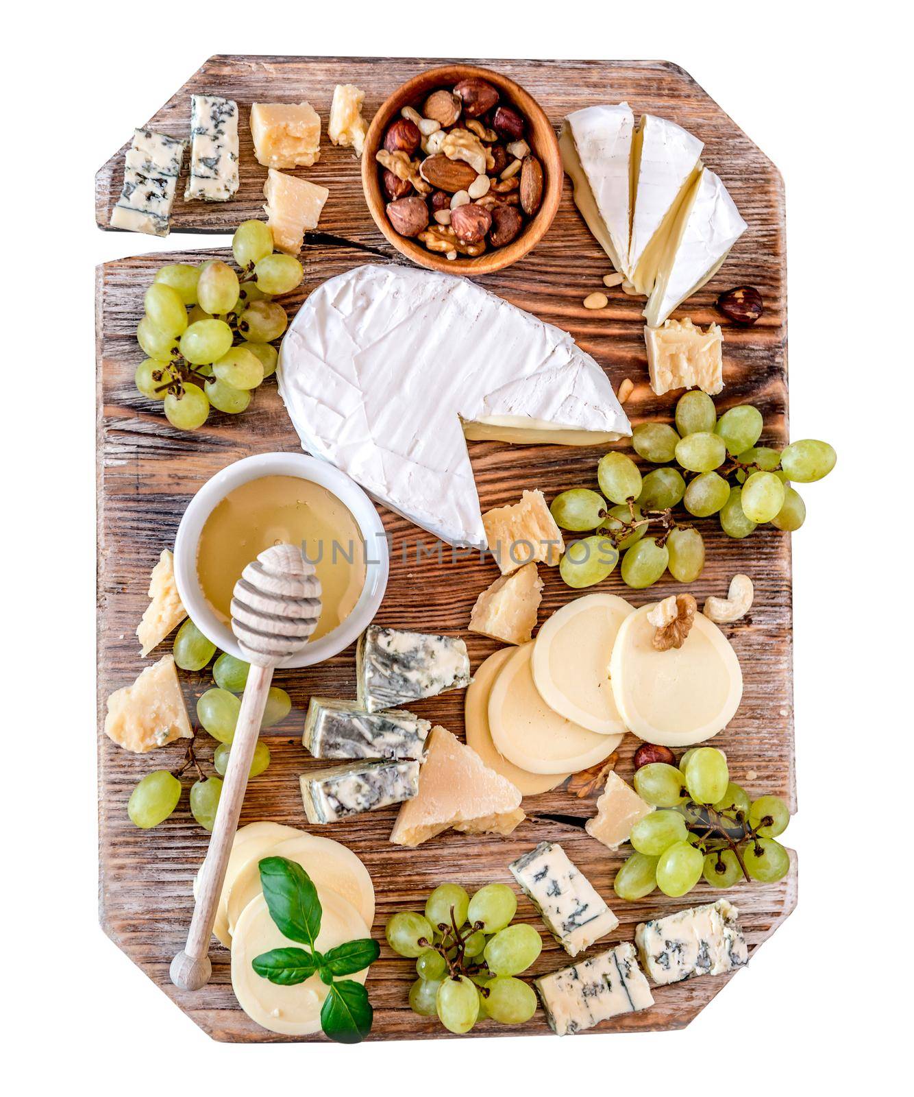 Cheese plate served with nuts and honey top view. isolated on white background