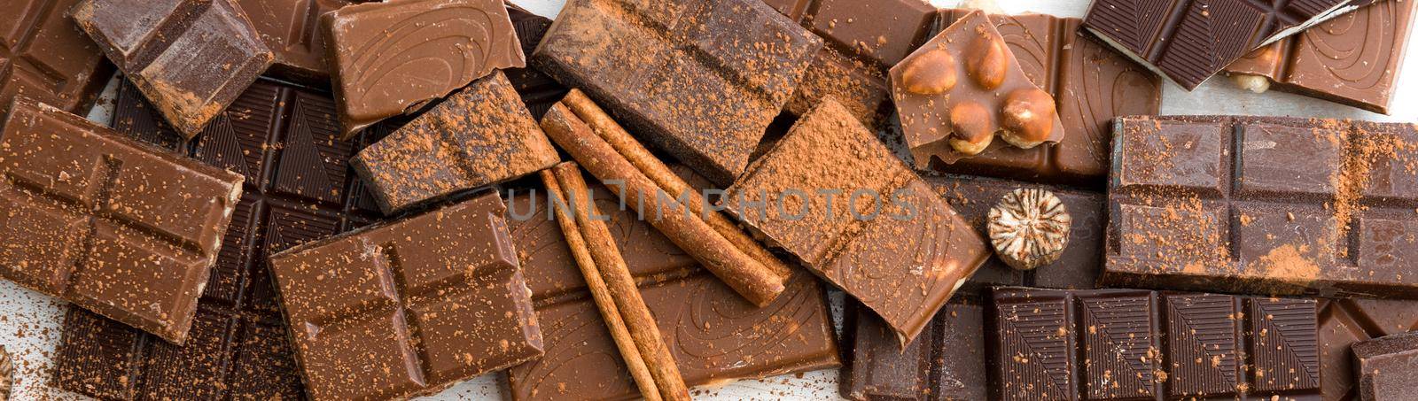 variety of chocolate on a wooden background with space for text
