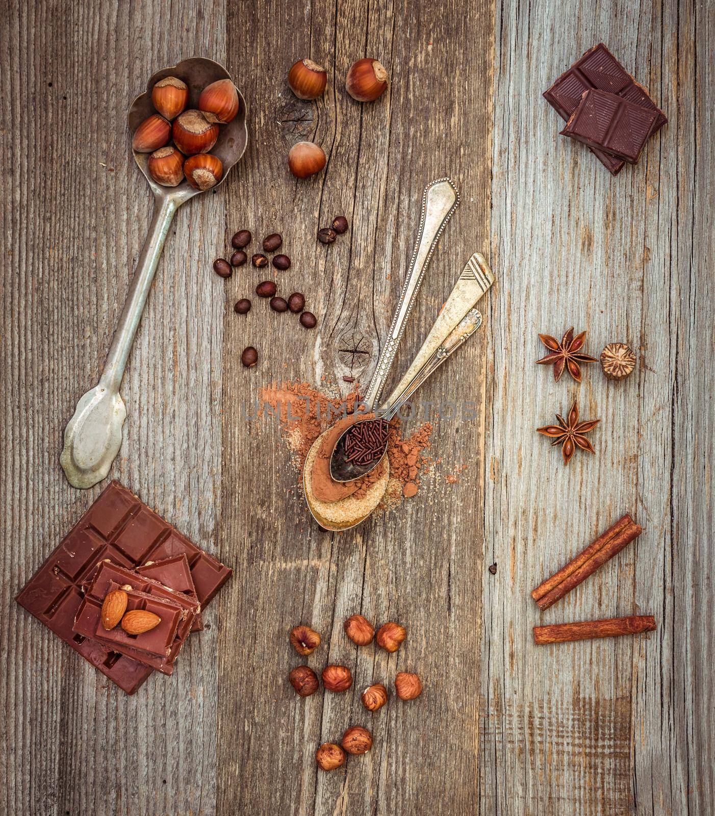coffee beans and chocolate on a wooden background.