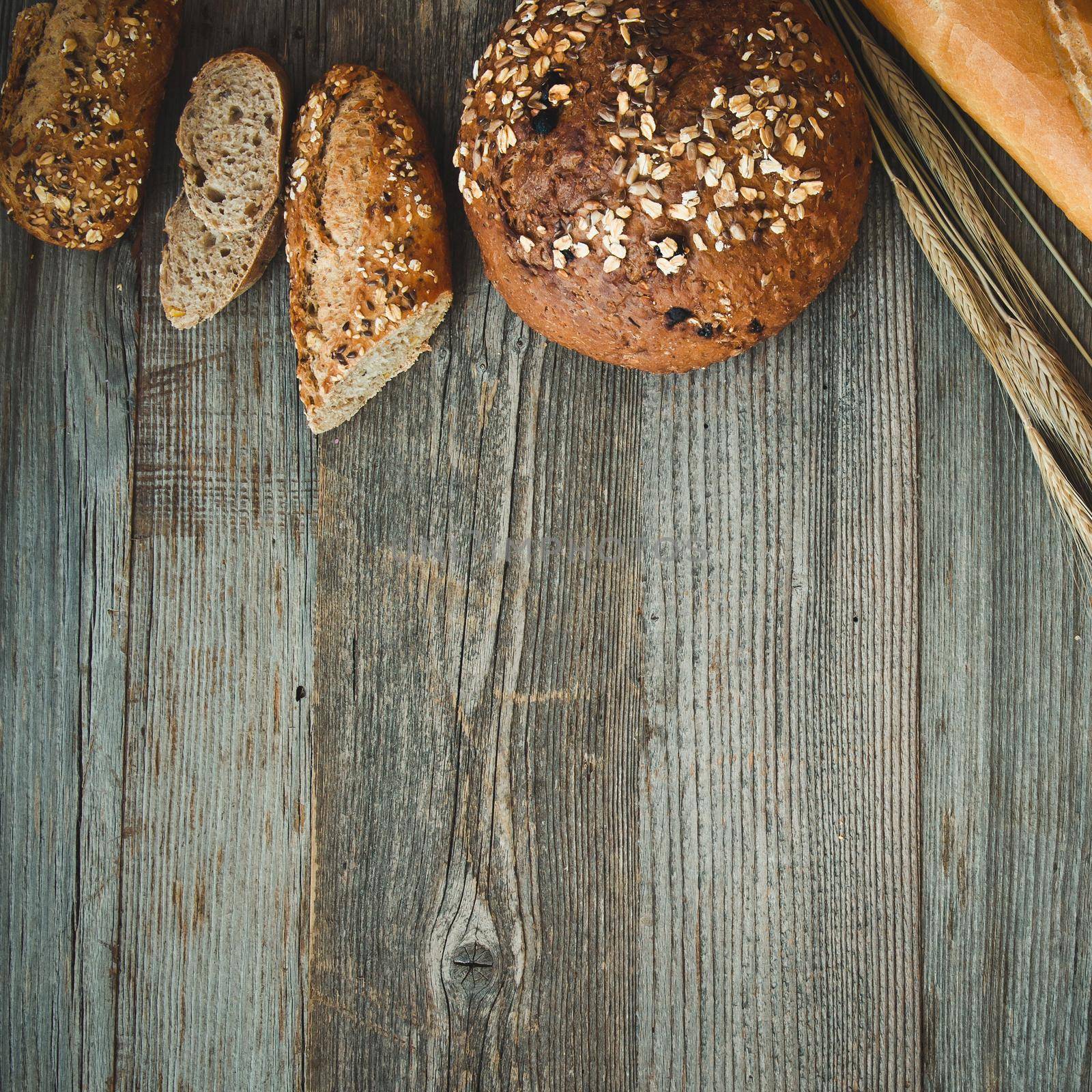 bread on a wooden background by tan4ikk1