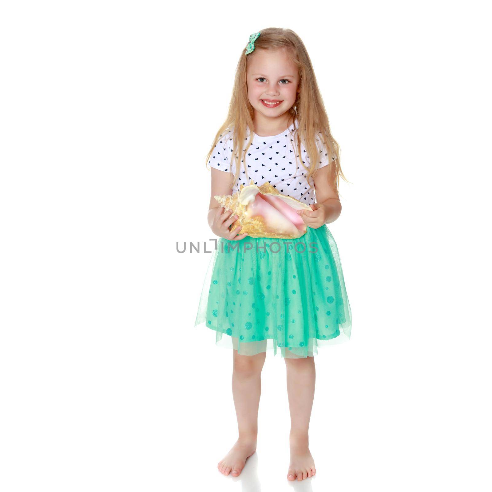 A little girl with a sea shell. The concept of a family vacation at sea, ecology. Isolated on white background.