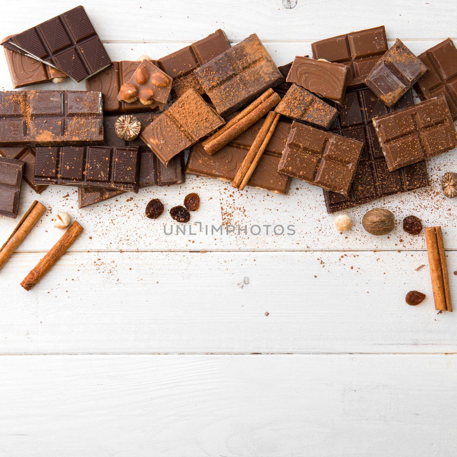 variety of chocolate on a wooden background with space for text