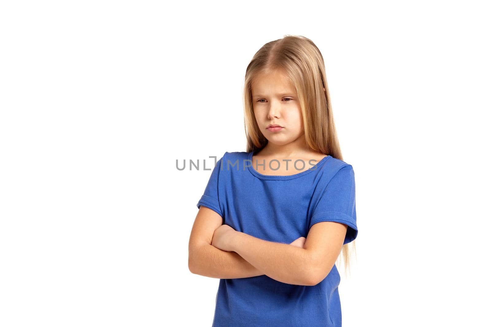 Portrait of adorable little girl isolated on a white background. in blue t-short with long white hair, upset