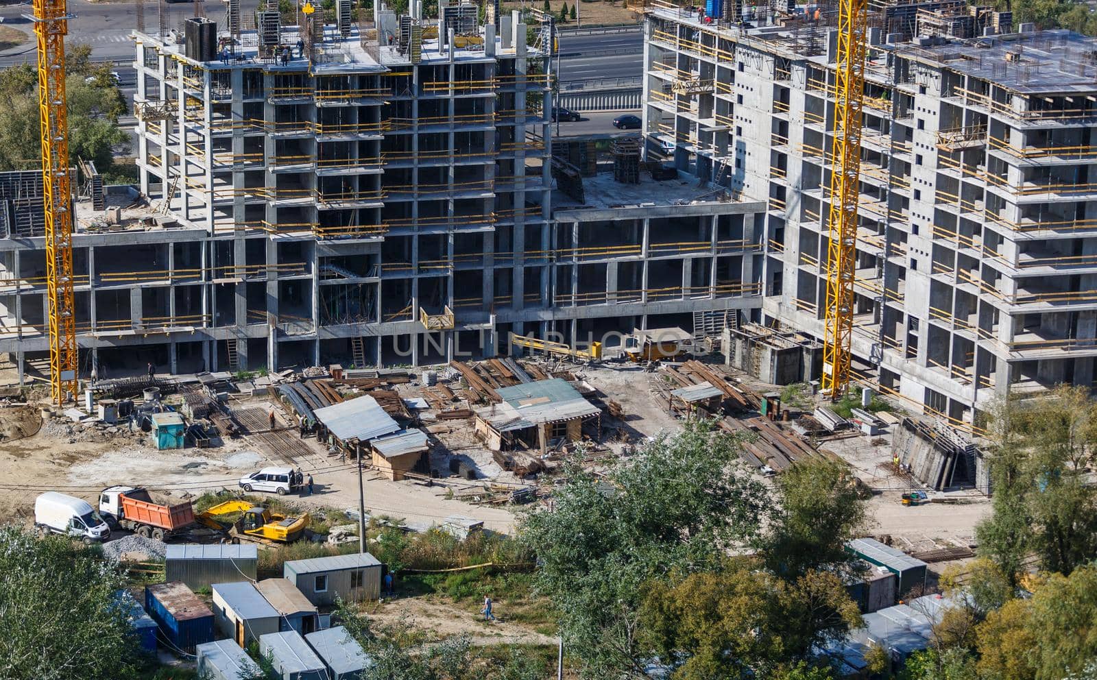 Construction site with concrete and steel and crane lifting equipment