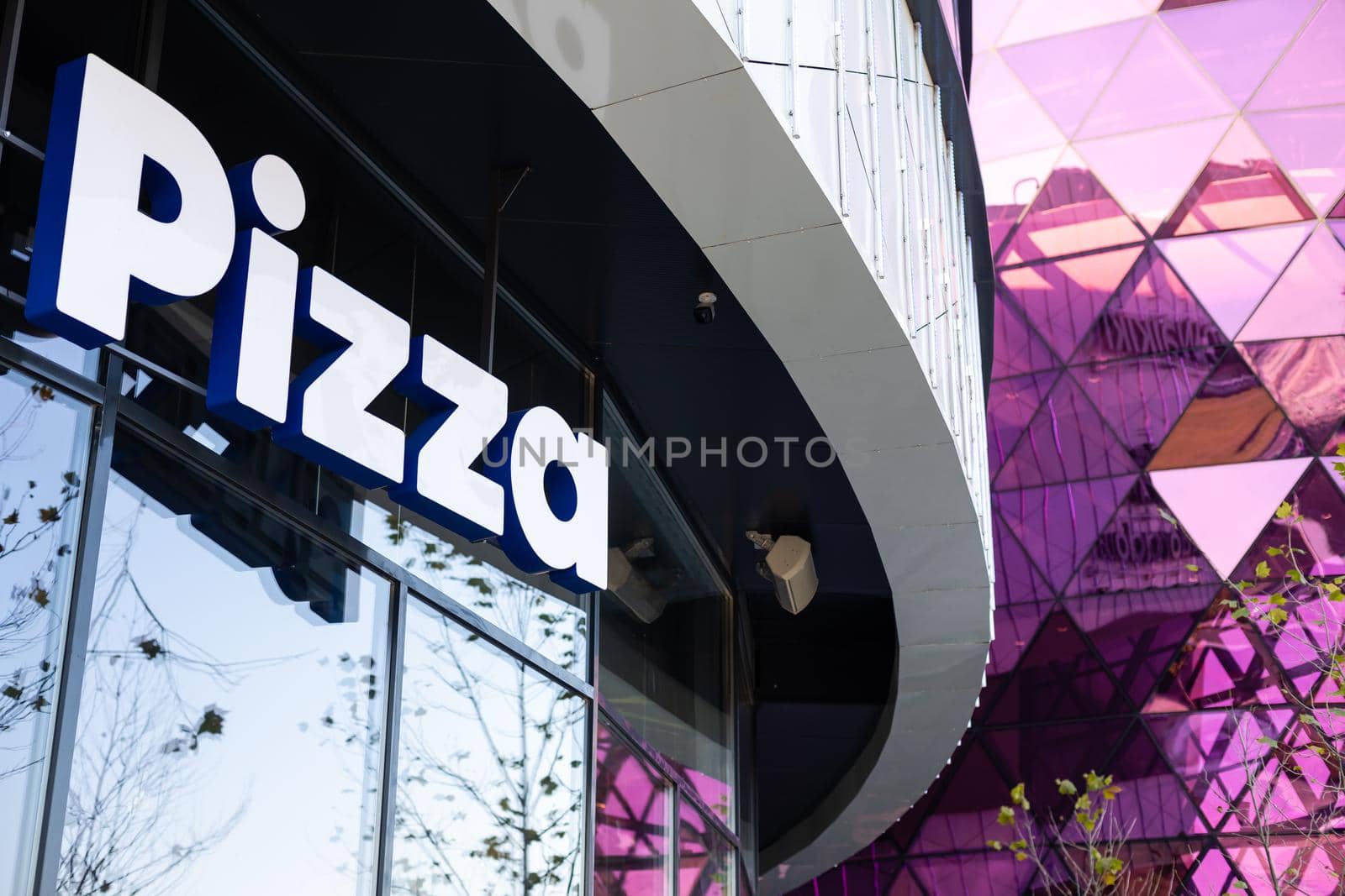 Kiev, Ukraine - November 17, 2021: Mall Respublika modern architecture. shopping center with glass walls. pizzeria Domino's by Andelov13