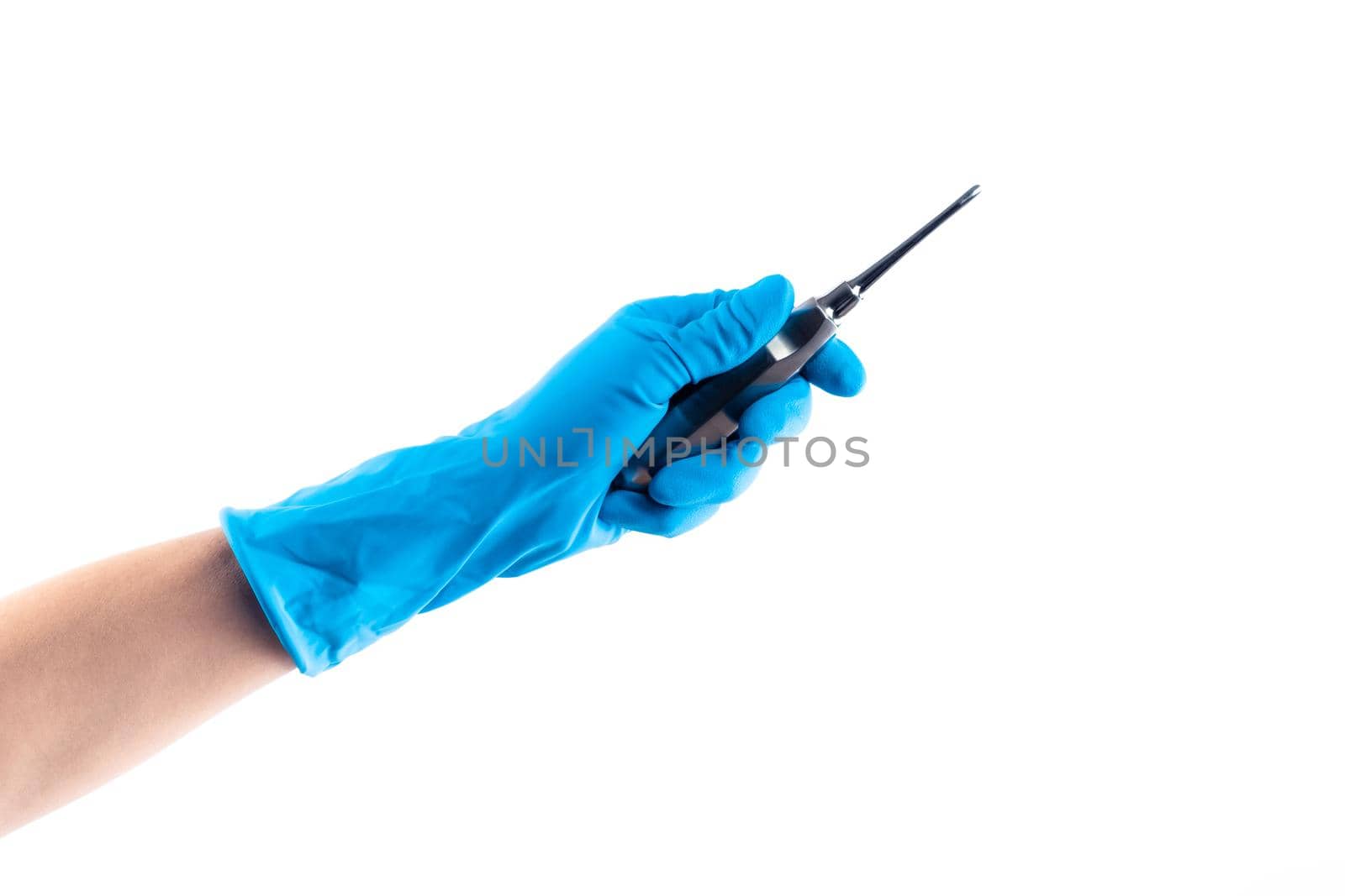 Hand in blue glove holding dental metal instrument isolated by GekaSkr