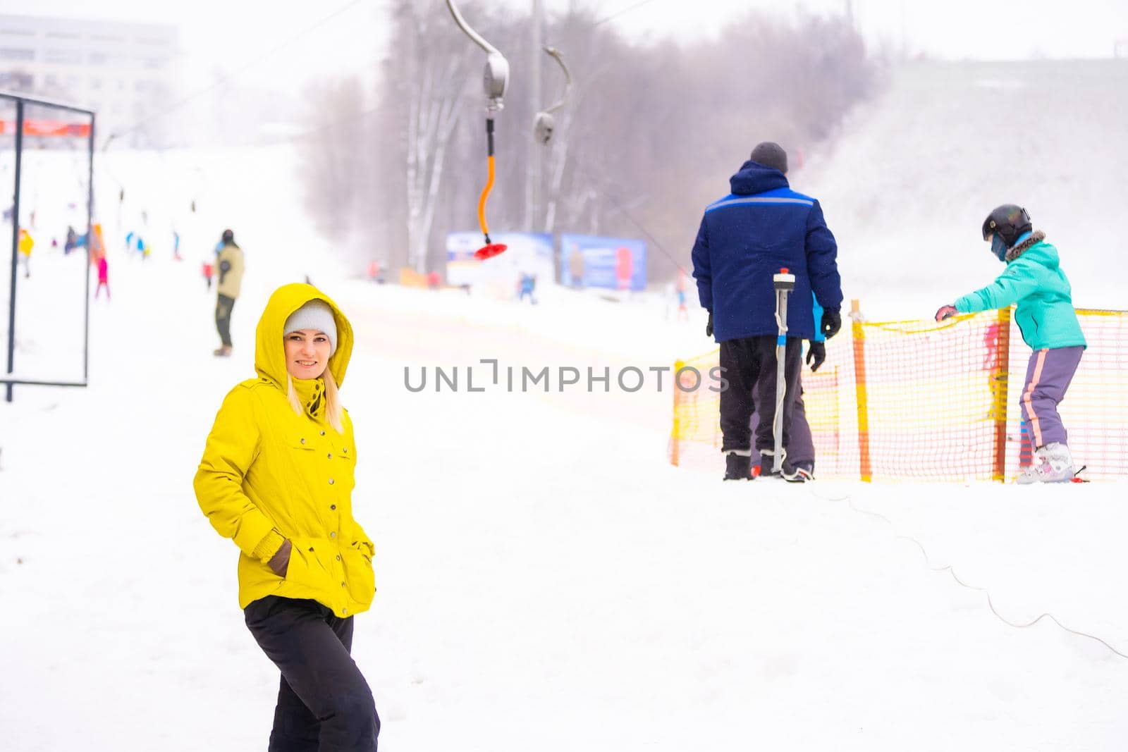 Tourists enjoy to play ski and snowboard at ski resort on holiday.