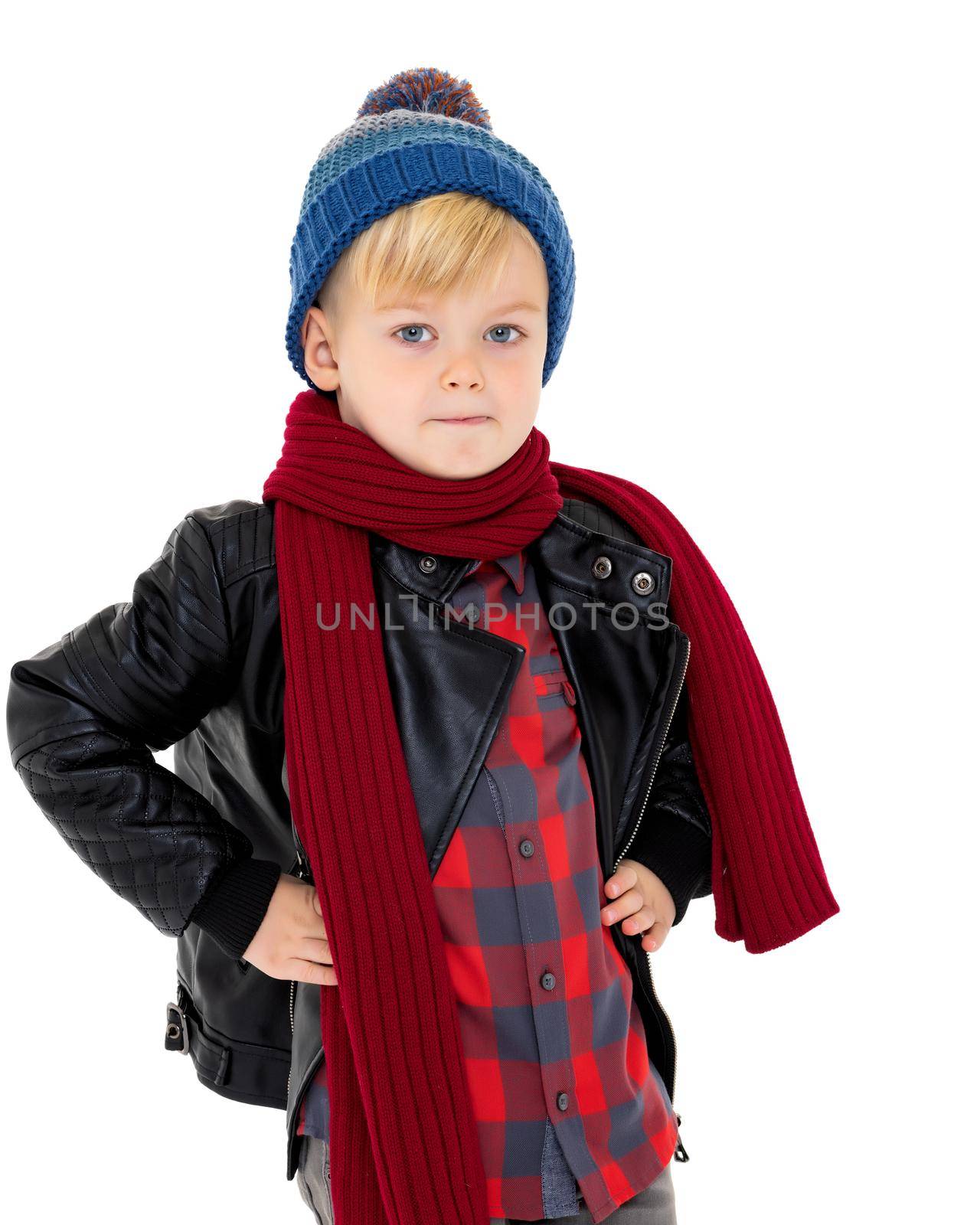 Little boy in a hat and scarf. by kolesnikov_studio