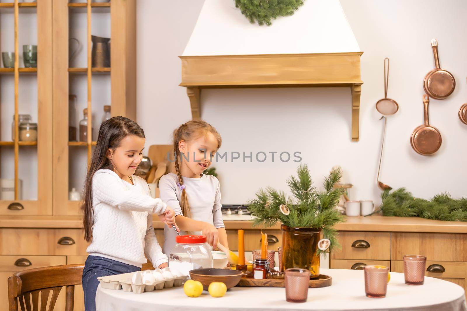 kids baking christmas cookies before the celebration of Christmas. Family by Andelov13