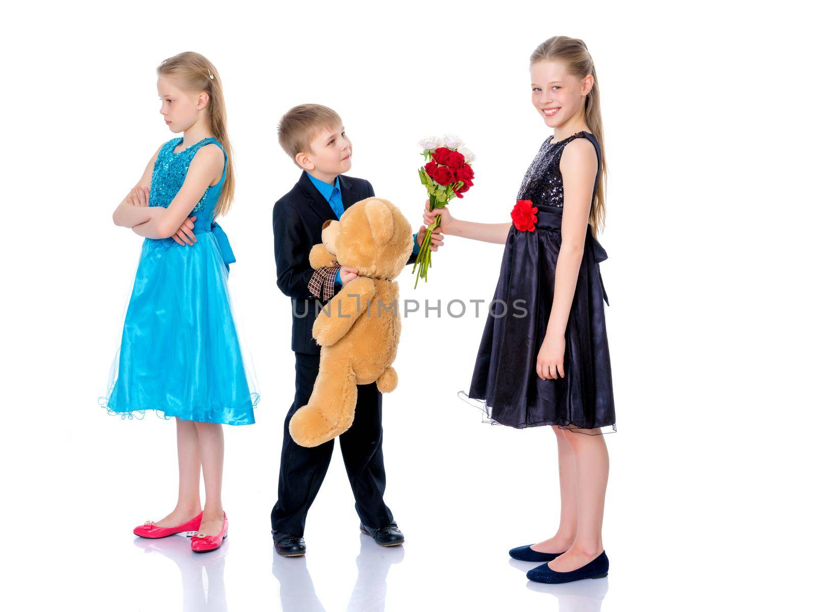 A little boy gives the girl flowers. by kolesnikov_studio