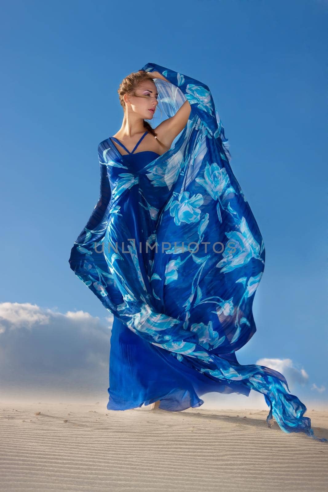 beauty woman in blue dress on the desert by Julenochek