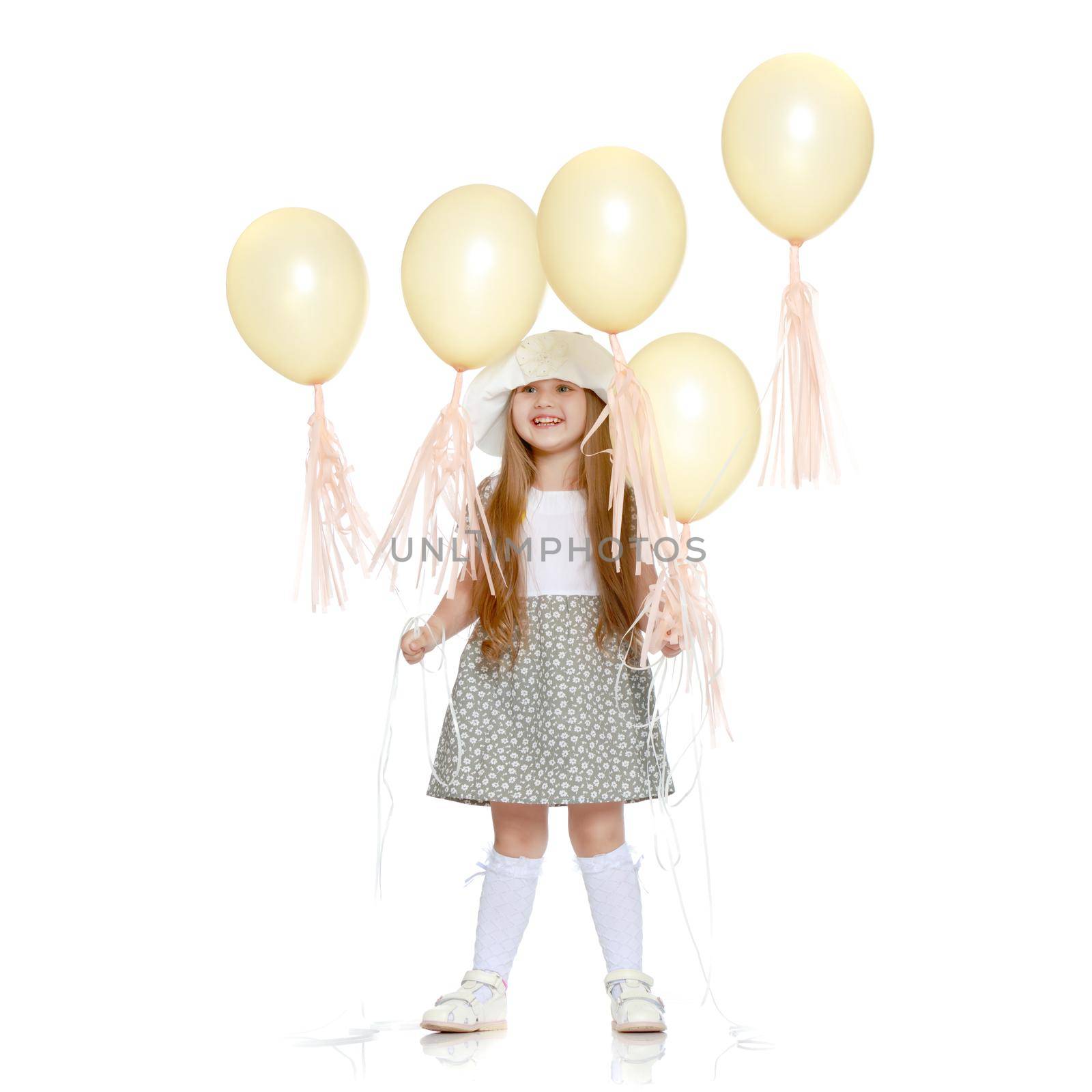 Little girl is playing with a balloon by kolesnikov_studio