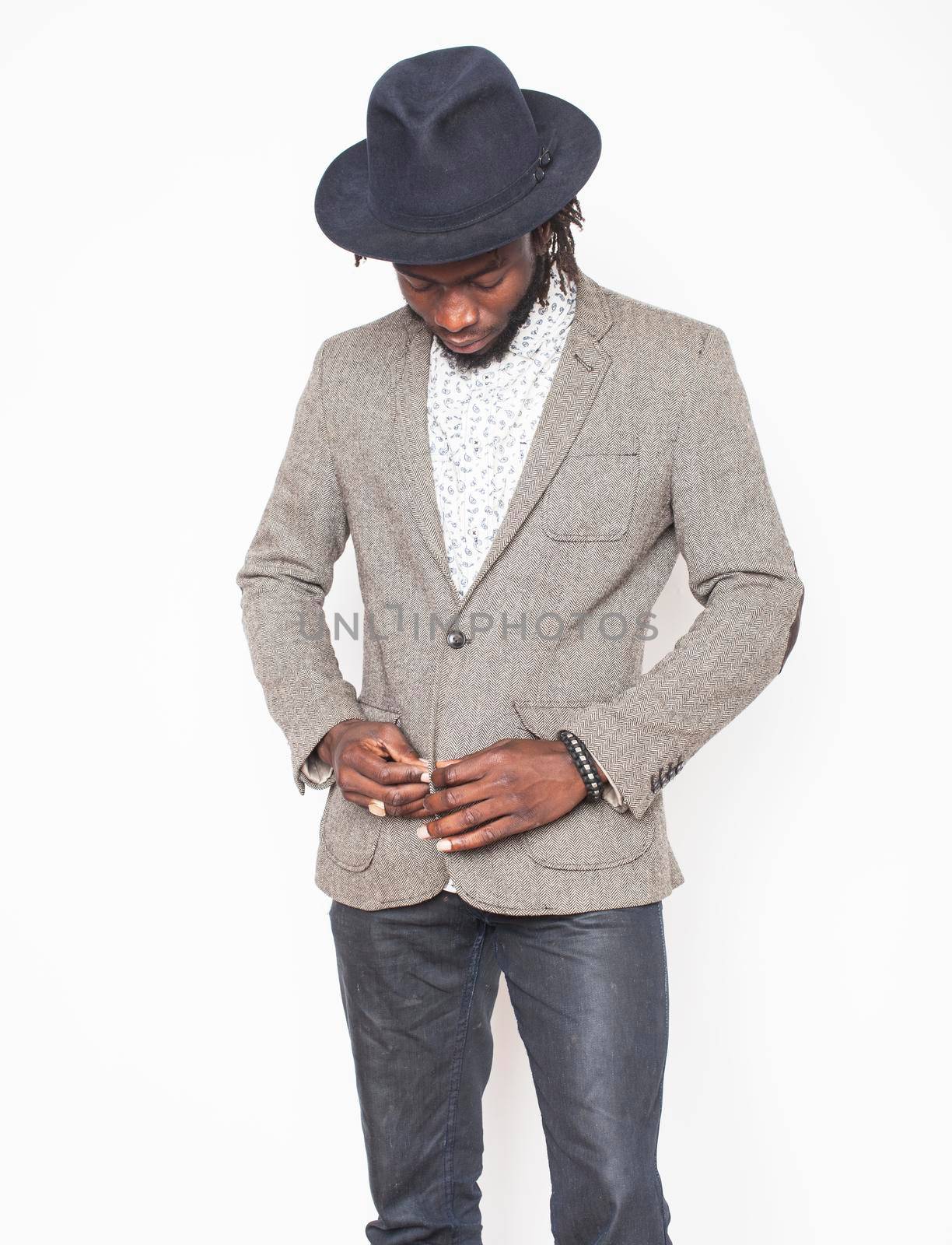 young handsome afro american boy in stylish hipster hat gesturing emotional isolated on white background smiling, lifestyle people concept close up