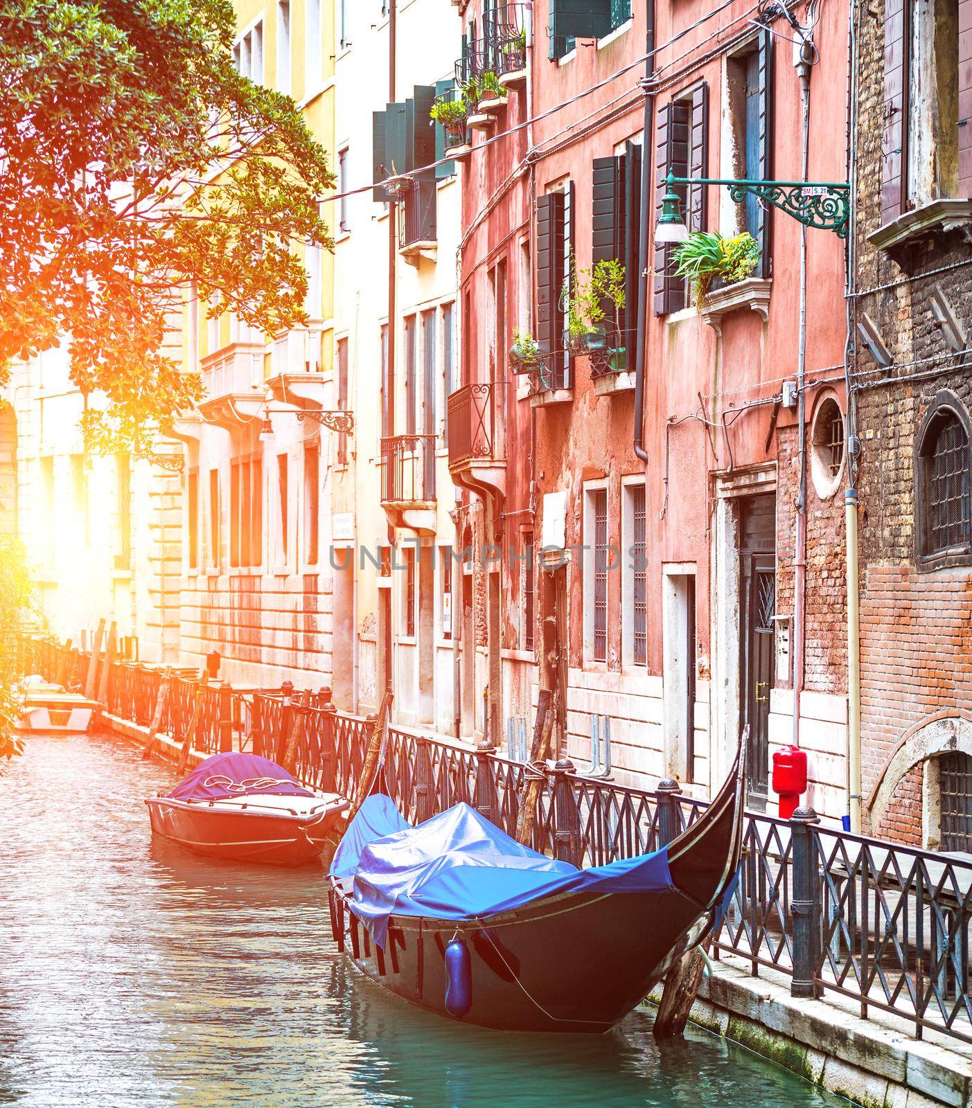 Venice, Italy, boats along the canal and historic tenements