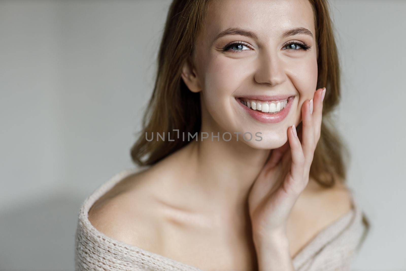Young happy woman with cream . High quality photo