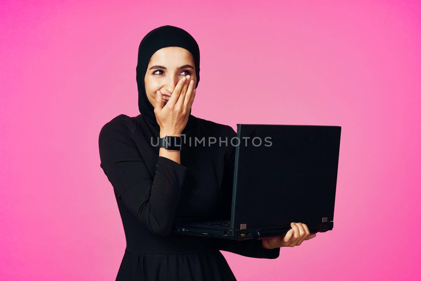 cheerful muslim woman with laptop education student internet technology. High quality photo