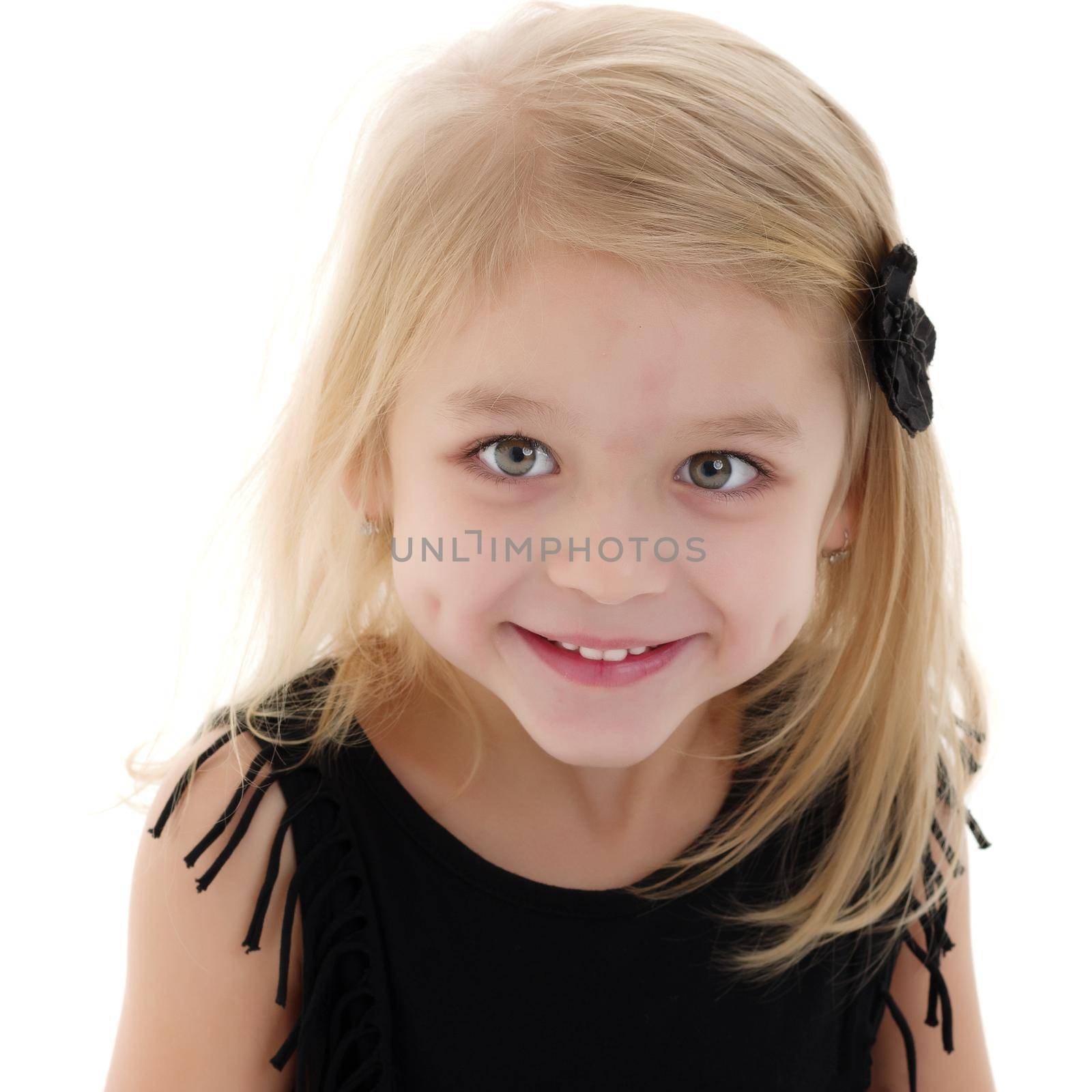 Beautiful little girl close-up. The concept of beauty and fashion, happy childhood. Isolated on white background.