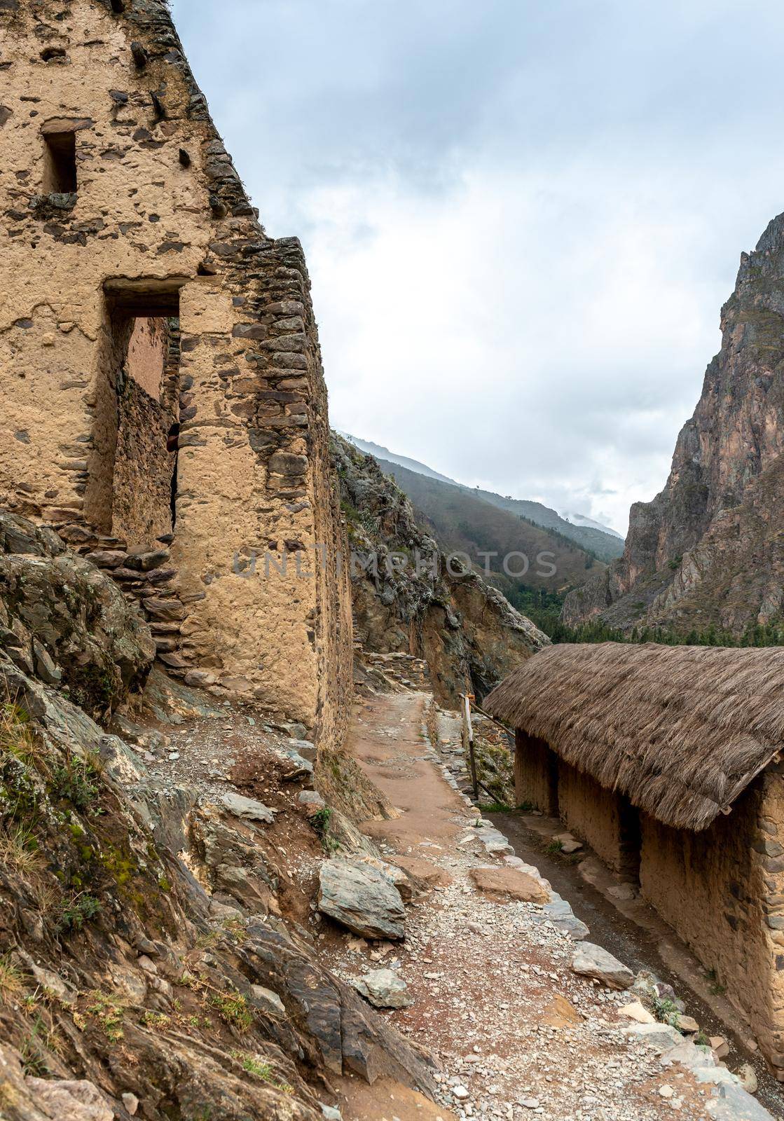 Old small house made of cobblestone at the hill of mountain in Ollantaytambo, Peru