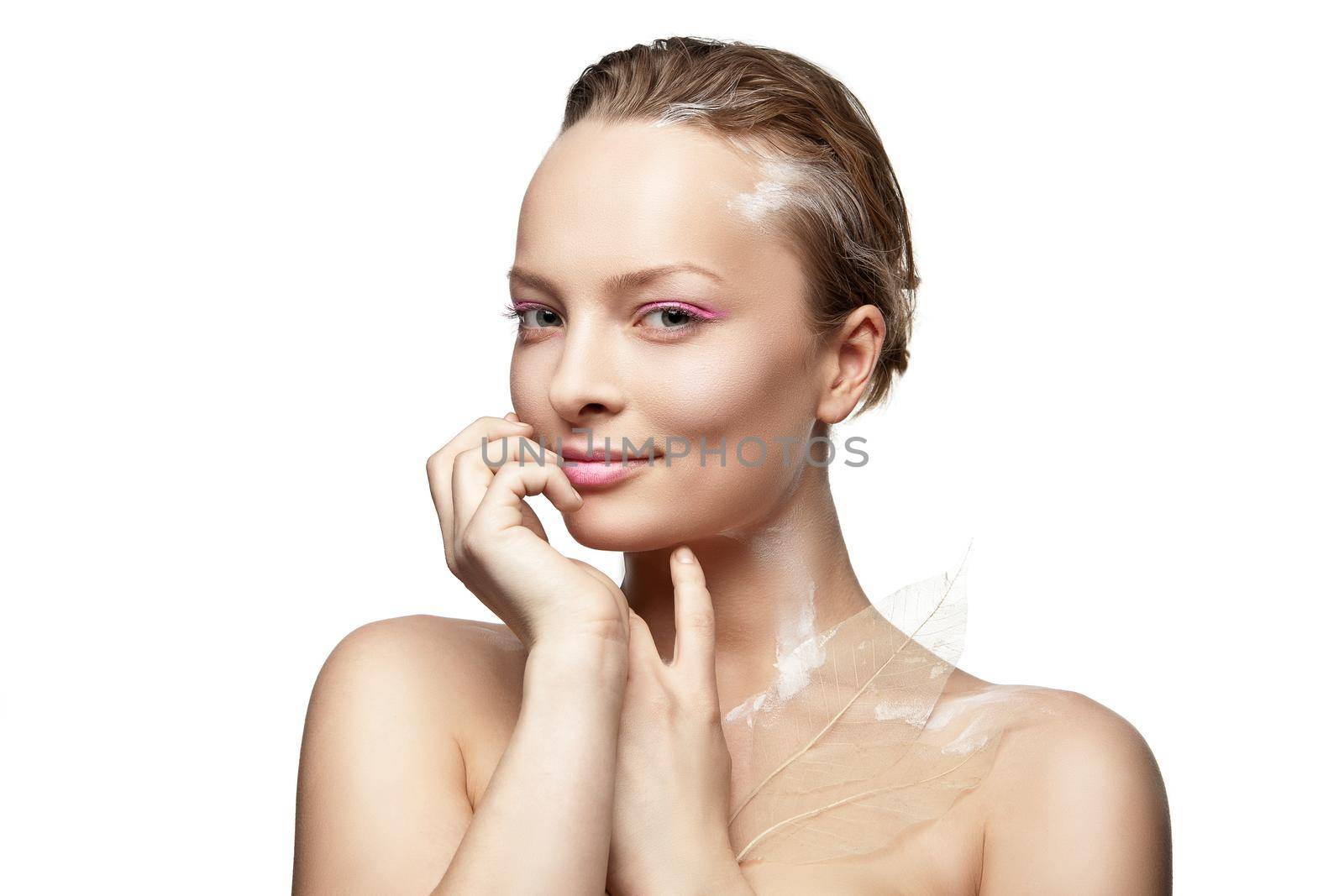 Beautyful smiling woman with creative make-up and white paint on body isolated