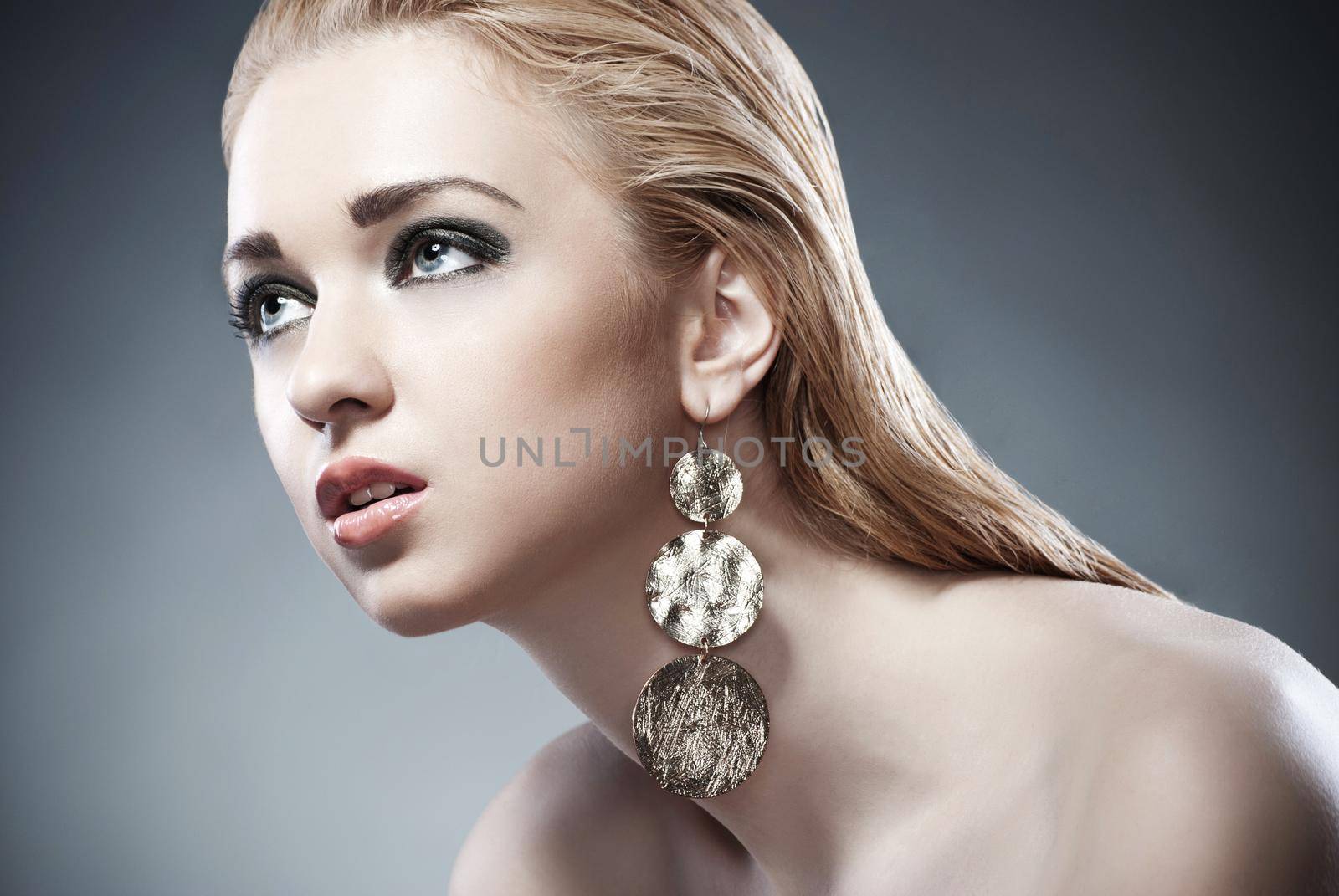 Beautiful woman with earrings. Jewelry and Beauty by Julenochek