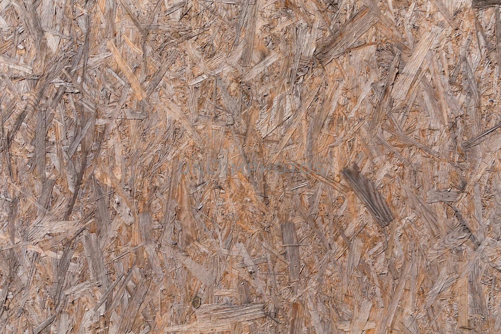 Old plywood recycled compressed wood chippings board background texture