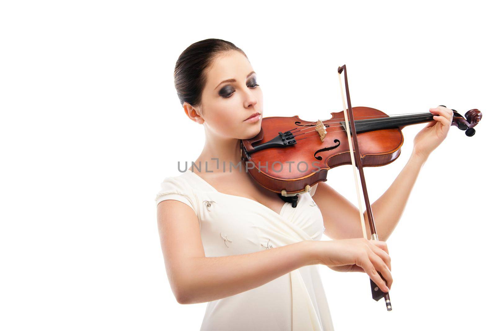 Beautiful young woman playing violin over white background