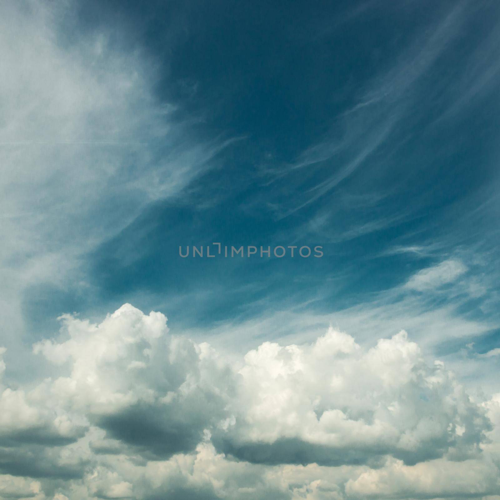 White clouds in a blue fantastic sky. Great background. horizontal