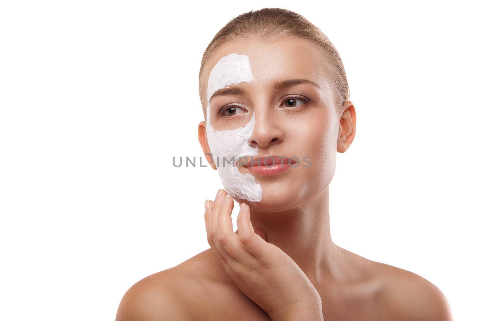 Woman with spa mask on her face isolated by Julenochek