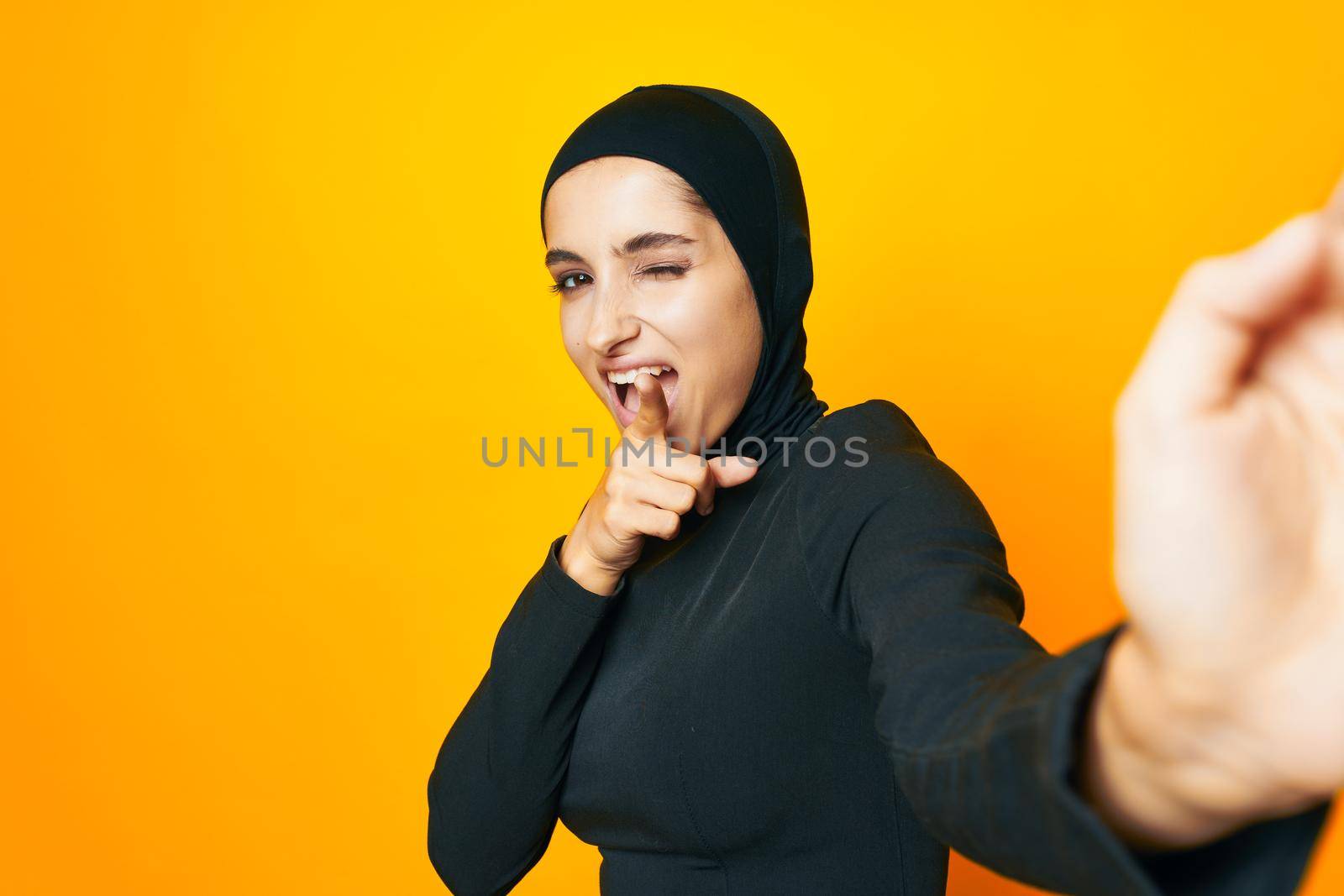 Muslim happiness fashion clothing hand gesture isolated background. High quality photo