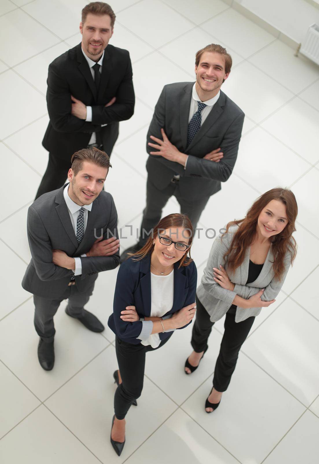 Top view of business people with their hands together in a circle