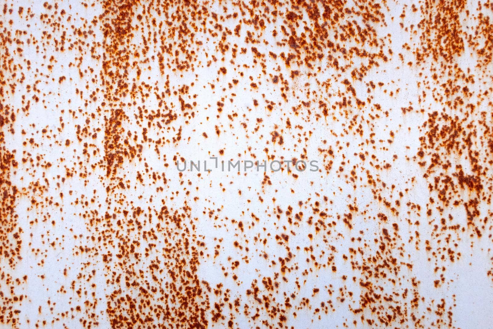 Rusty iron and the remnants of gray paint.Horizontal background.