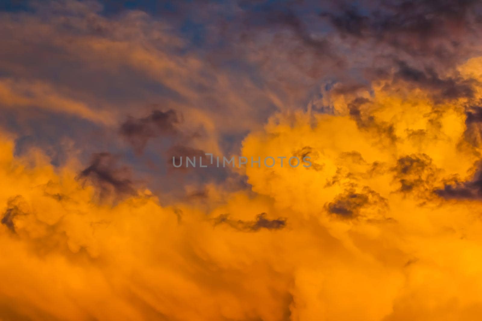 Background from a bright colorful sunset with clouds. High quality photo
