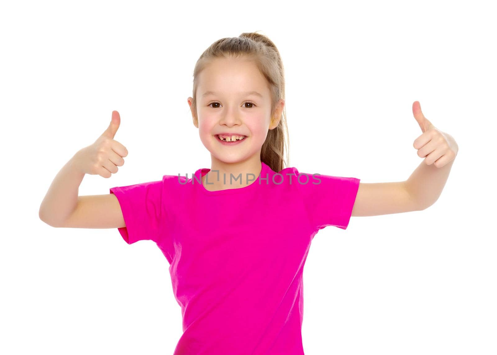 Little girl holding her thumb up. Concept Happy childhood, holiday, birthday.Isolated on white background