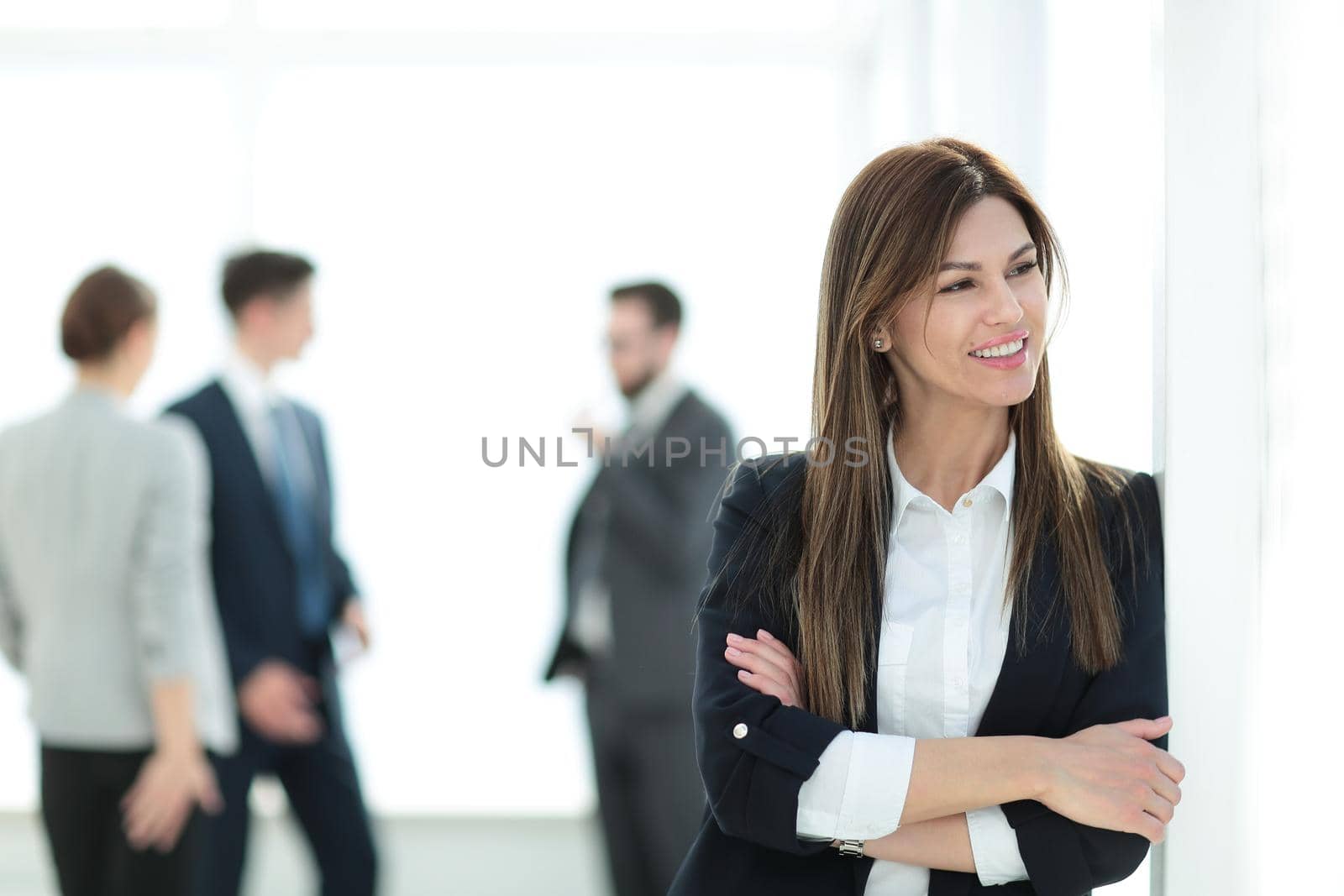 young business woman on blurred office background. by asdf