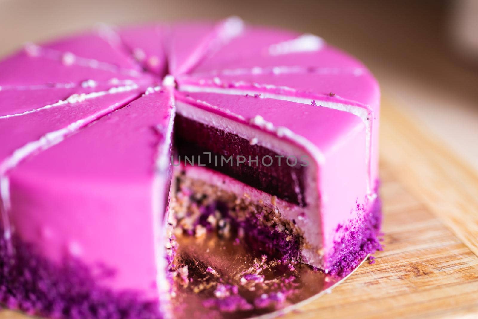 Pink and violet birthday cake without one piece. Dessert, holidays and delicious concept. by Satura86